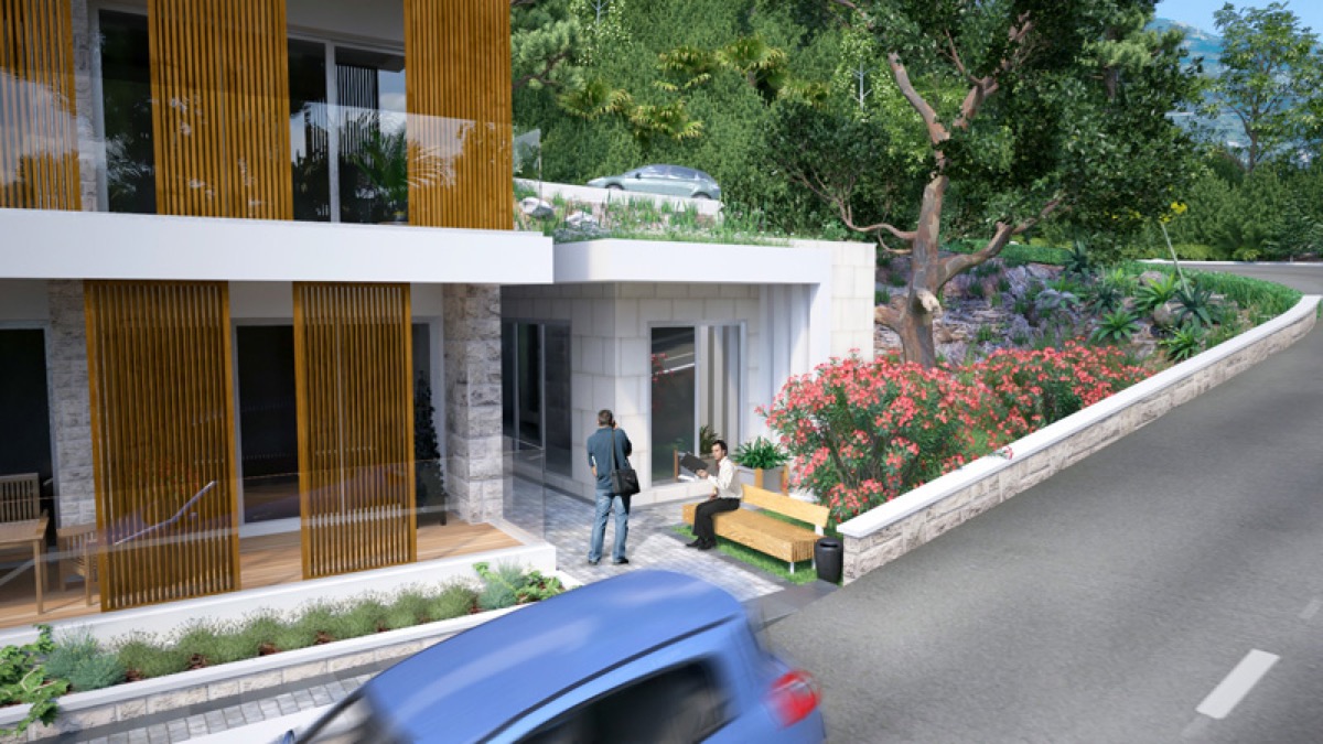 Moderner Wohnkomplex in Budva, Montenegro: Fassade mit Holzpaneelen, Terrasse und Landschaftsgestaltung.