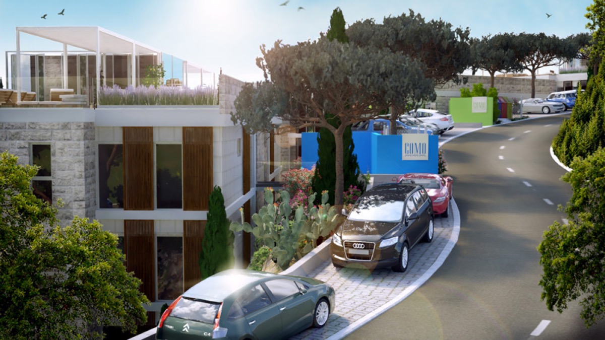 Moderner Wohnkomplex Como in Budva, Montenegro: Blick auf die Fassade des Gebäudes, den Parkplatz und das gepflegte Gelände.