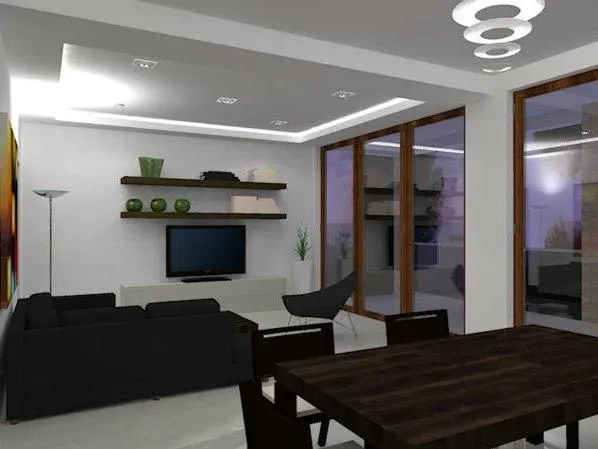 Ein modernes Wohnzimmer mit einem schwarzen Sofa, TV und Holzesstisch.