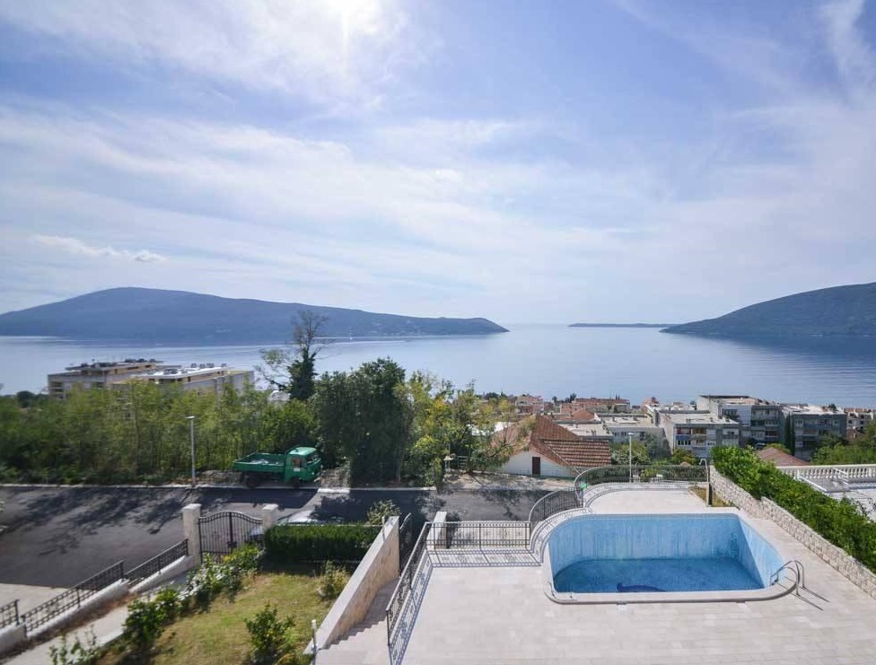 Sea and mountain view from the terrace of a villa with a pool in Herceg Novi, Montenegro. Panoramic coastal landscape.