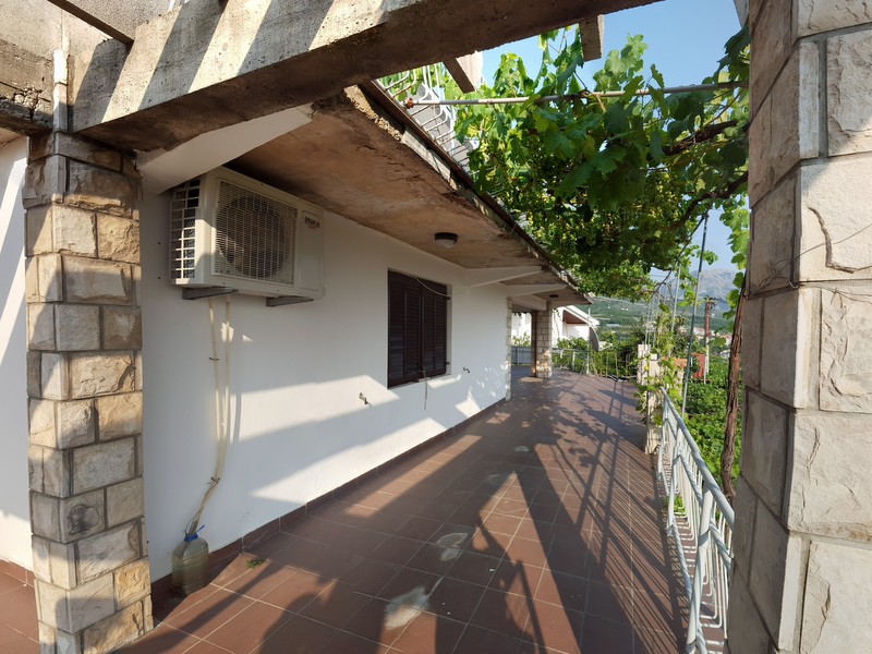 Spacious terrace with a vineyard and stone columns in a house, Shushan, Montenegro.