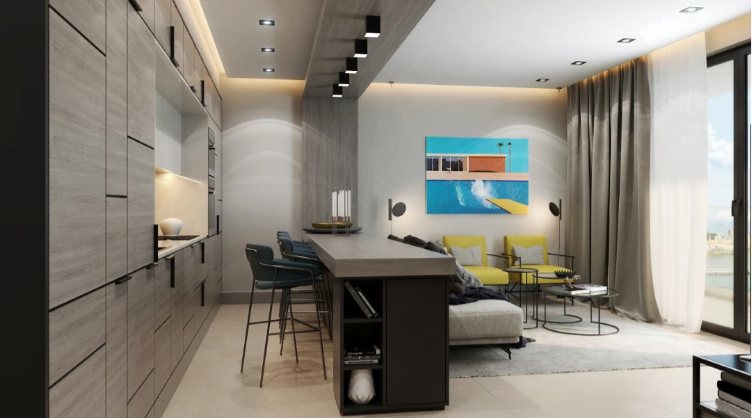Karadağ, Bečići’deki konut kompleksinde modern mutfak-salon: şık mutfak dolapları, bar tezgâhı ve deniz manzarası.