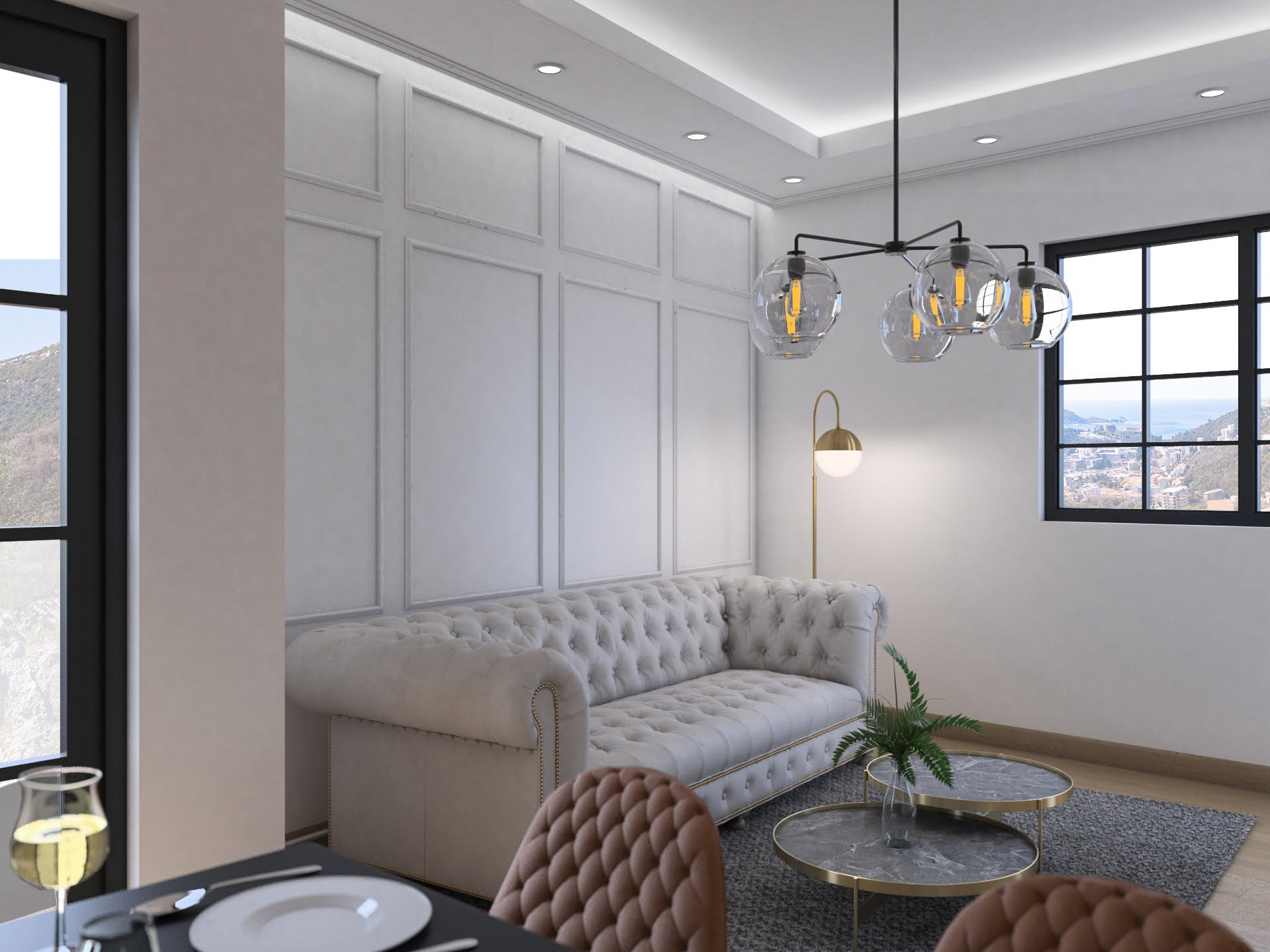 Becici’deki, Budva Rivierası, Karadağ’daki konut kompleksinde Chesterfield kanepeli ve deniz manzaralı modern tarzda oturma odası.