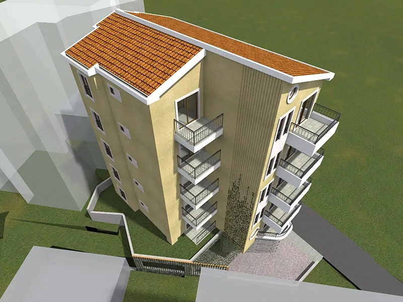 Draufsicht auf ein hohes gelbes Gebäude mit Terrakottadach und Balkonen.