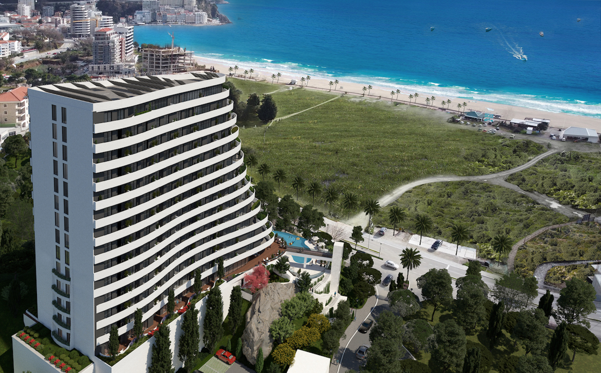 Modern residential complex in Bečići, Montenegro: aerial view of a seaside building with a pool and panoramic beach.