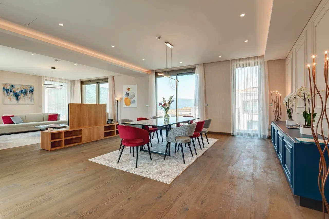 Modern living room with dining area in an apartment in Portonovi, Kumbor, Montenegro: designer furniture and sea view.
