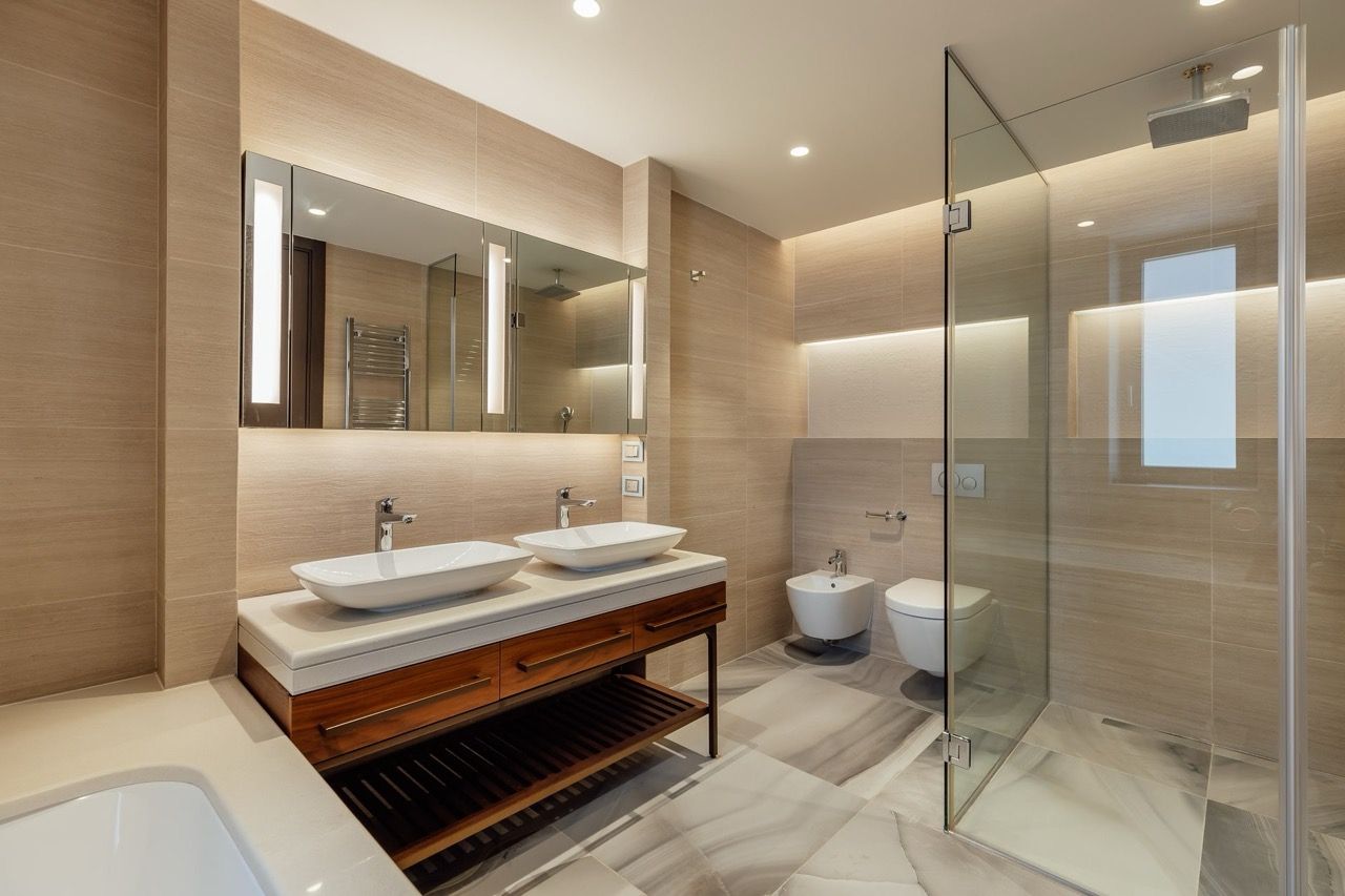 Modern bathroom with two sinks and a shower cabin in Portonovi villa, Kumbor, Montenegro.