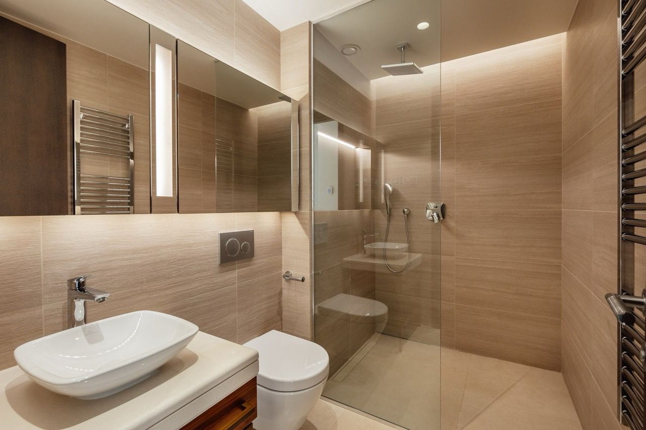 Modern bathroom with a shower cabin and wood-style finishes in a villa in Portonovi, Kumbor, Montenegro.
