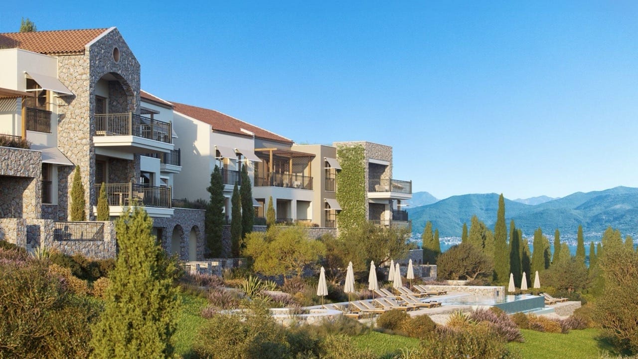 Luxury residential complex in Luštica Bay, Radovići, Montenegro: stone facade finishes, terraces, and a swimming pool with sea views.