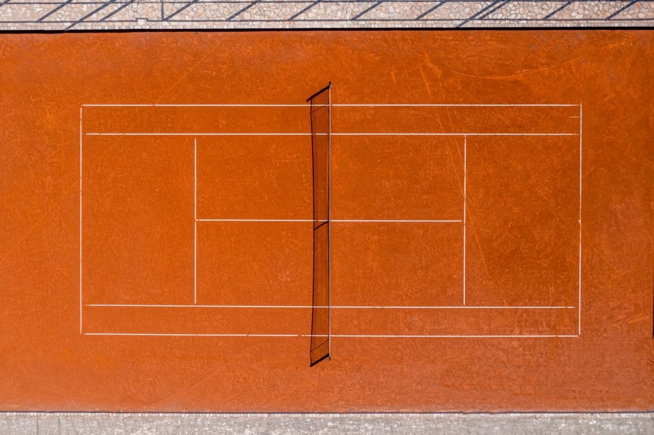 Top view of a professional clay tennis court in the Lustica Bay residential complex, Radovici, Montenegro.