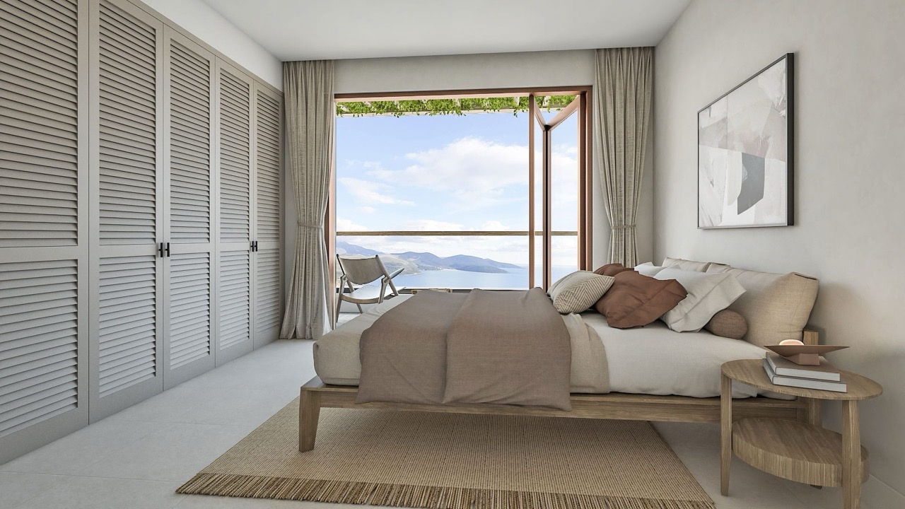 Modernes Schlafzimmer in einer Villa in Luštica Bay, Radovići, Montenegro: Meerblick, Holzbett und Lamellenschränke.