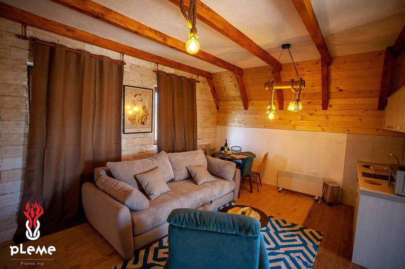 Cozy wooden-style living room with rope lights in a residential complex, Žabljak, Montenegro
