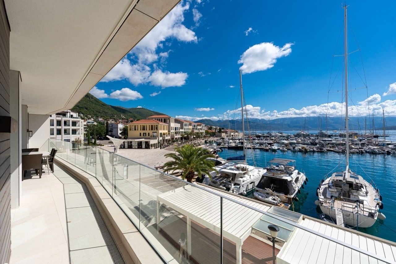 Terrace with furniture and views of the Portonovi yacht marina, Kumbor, Montenegro: modern finishes and panoramic views.