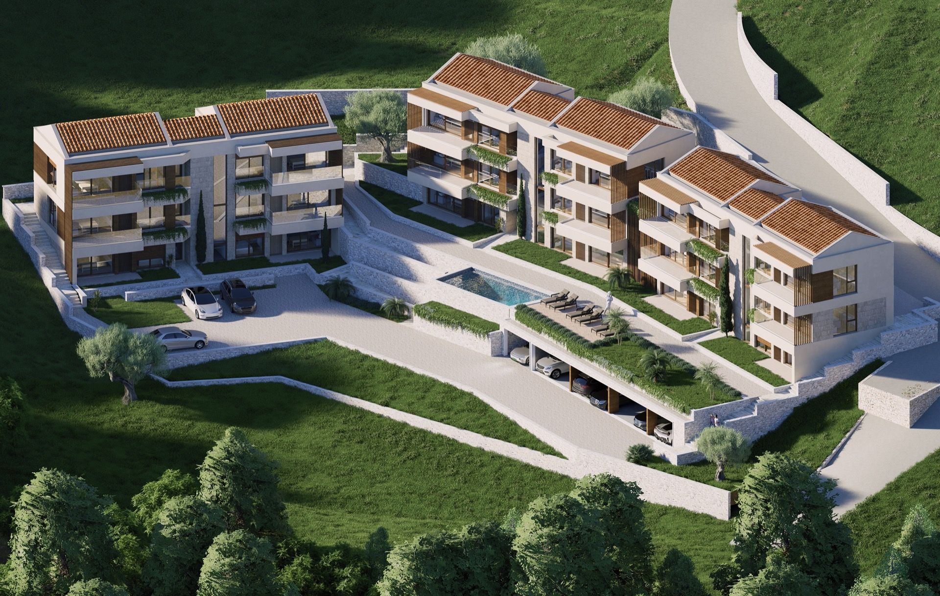 Blick von oben auf eine Wohnanlage in Blizikuće, Montenegro: moderne Wohnungen mit Pool, Parkplatz und Terrassen.