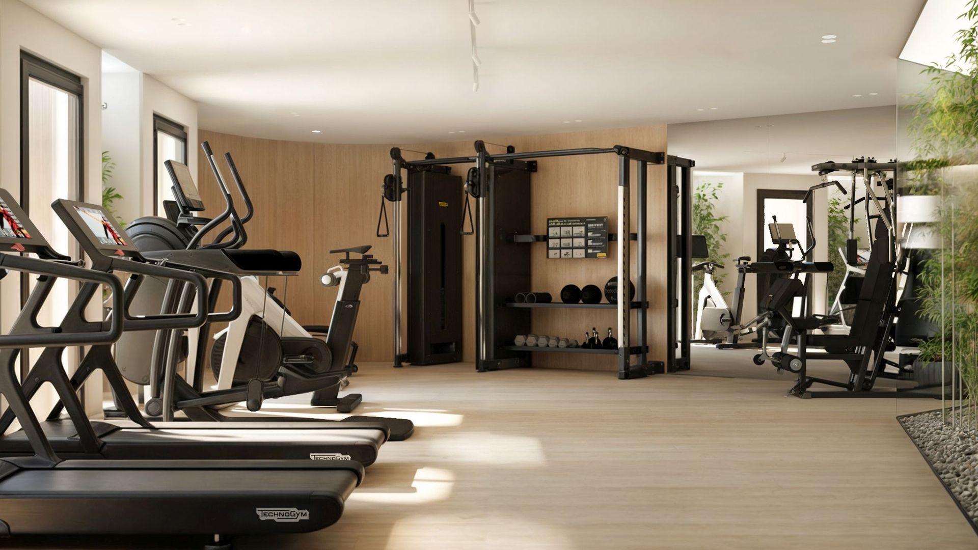Salle de sport moderne avec équipements Technogym dans un complexe résidentiel à Reževići, Monténégro.