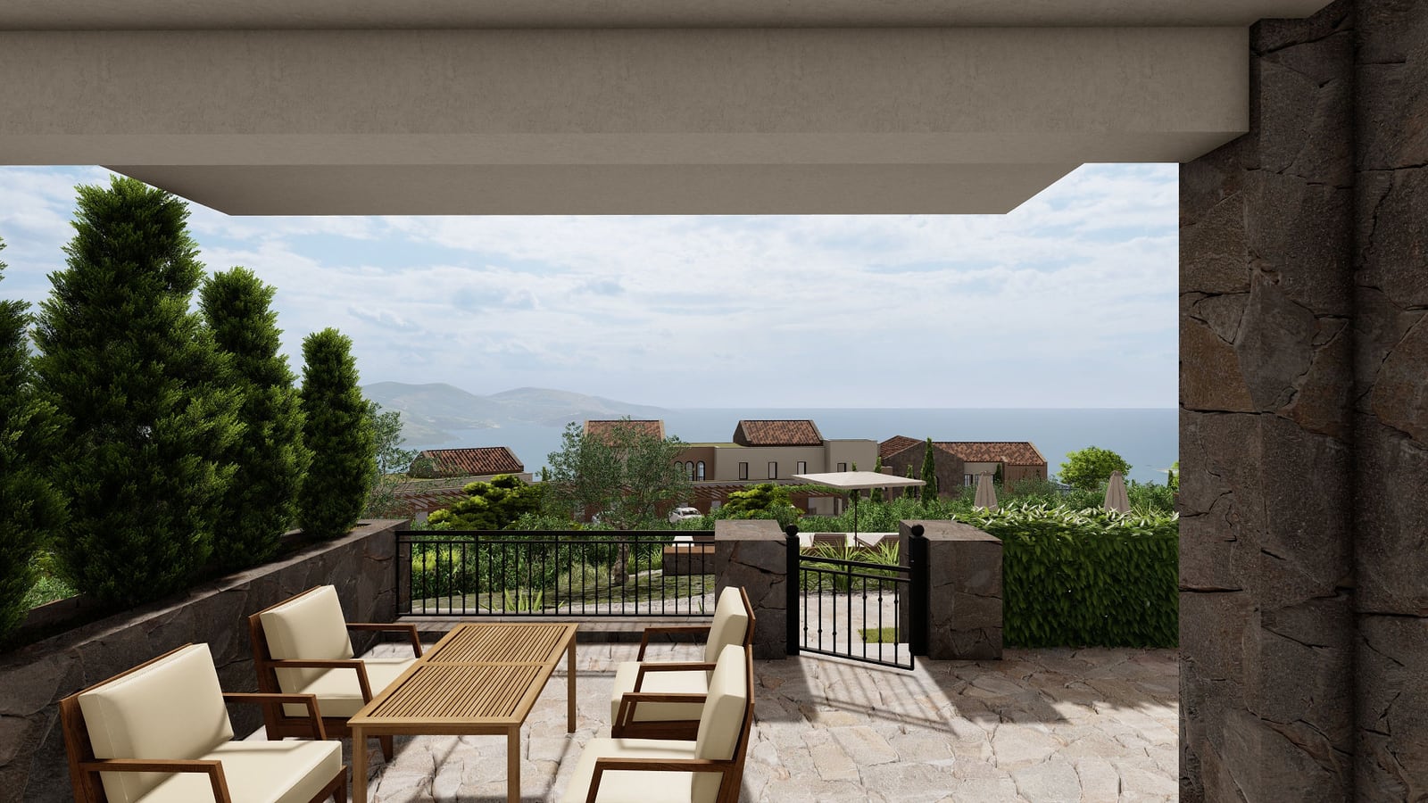 Terrasse mit Gartenmöbeln und Panoramablick auf das Meer im Wohnkomplex Lustica Bay, Luštica, Montenegro.