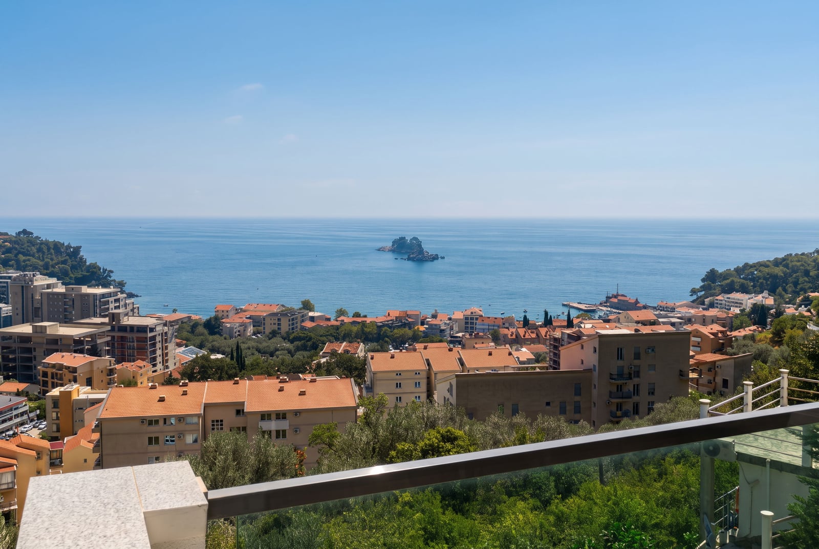 Panoramic view of the Adriatic Sea and the town of Petrovac from the balcony of an apartment in Montenegro.