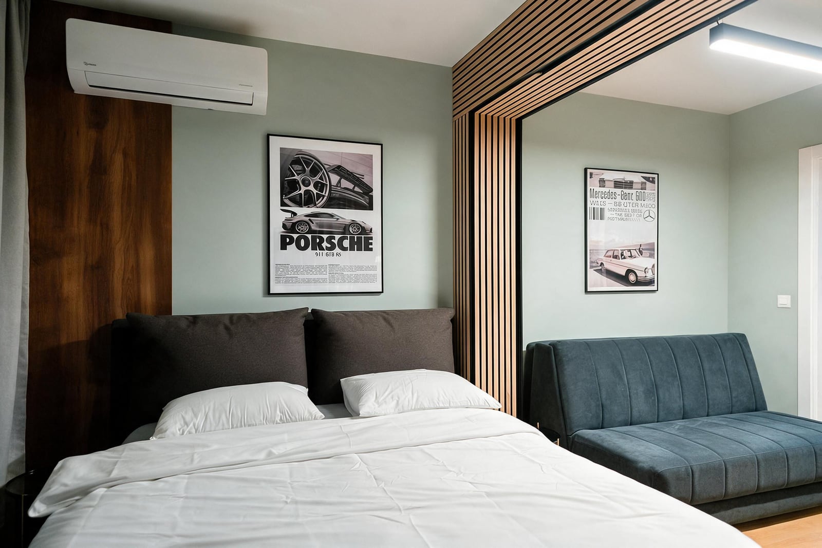 Modern bedroom with a double bed, sofa, and wooden panels in an apartment in Budva, Montenegro