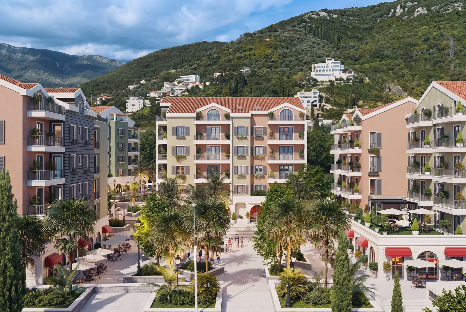 Modern residential complex with balconies, palm trees in the courtyard, and mountain views in Tivat, Montenegro