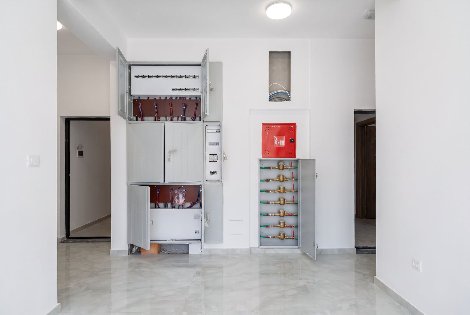Electrical panel and water meters in a new apartment in the city of Bar, Montenegro, with quality interior finishes.