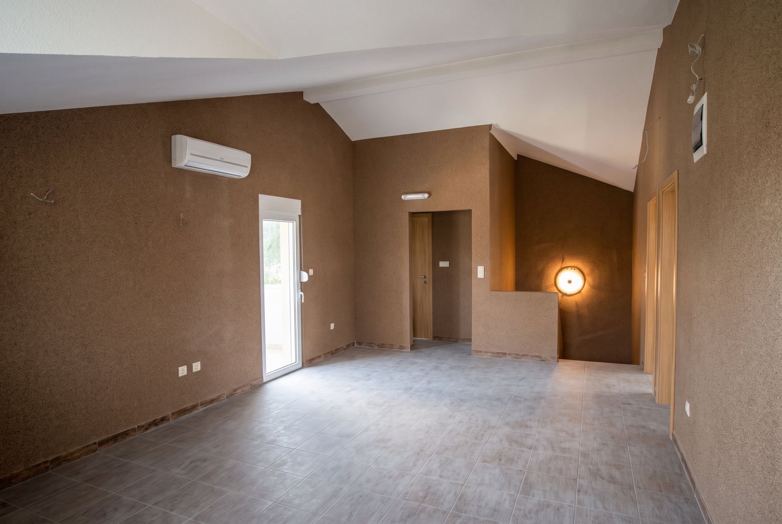 Spacious living room with wall finishes in a house in Tivat, Montenegro