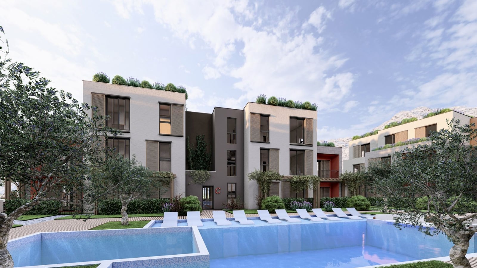 Complexe résidentiel moderne avec piscine et aménagement paysager à Radanovici, Monténégro : vue sur la façade du bâtiment.