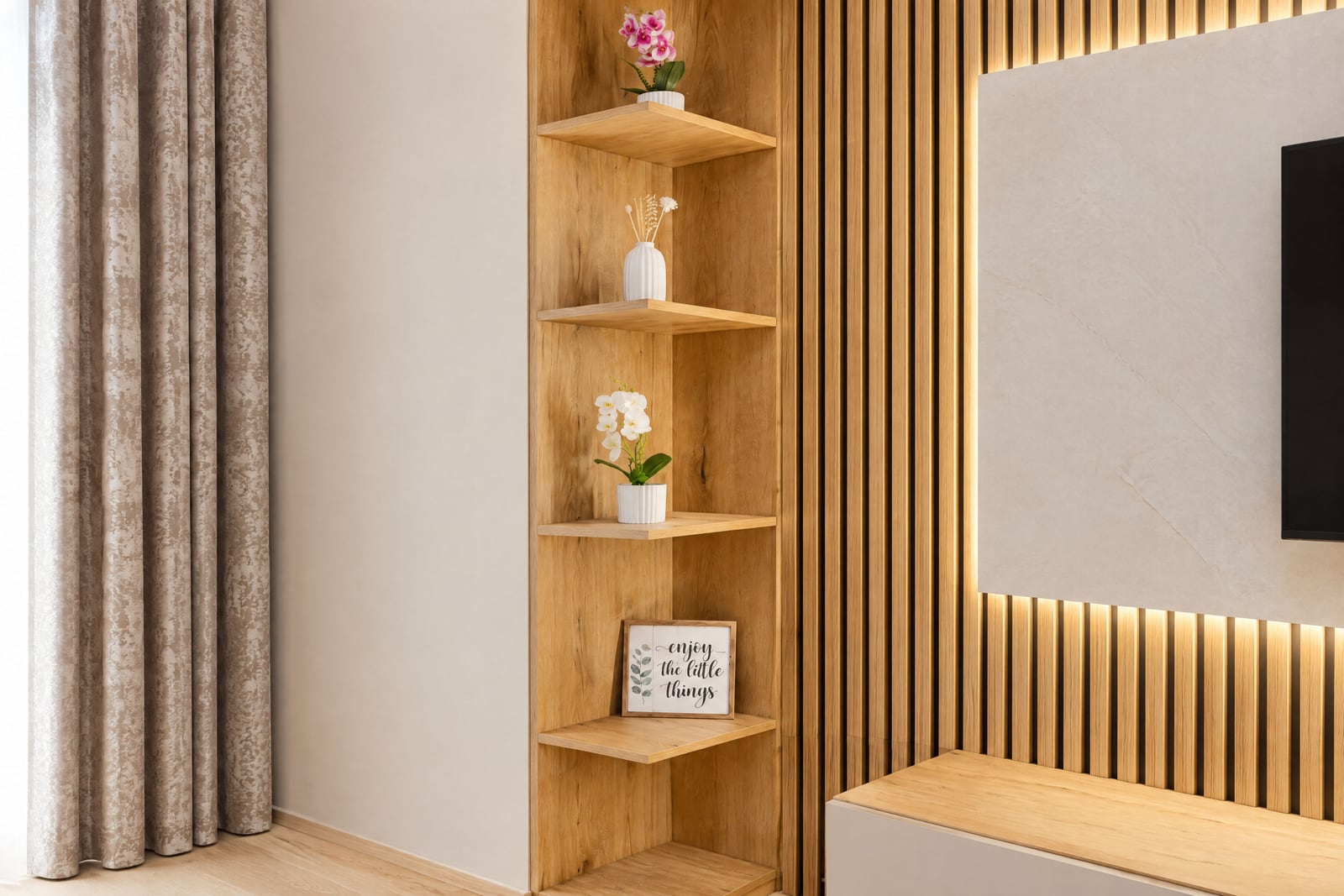 Wooden corner shelves with flowers and decor, slatted wood wall with backlighting, and TV area edge.