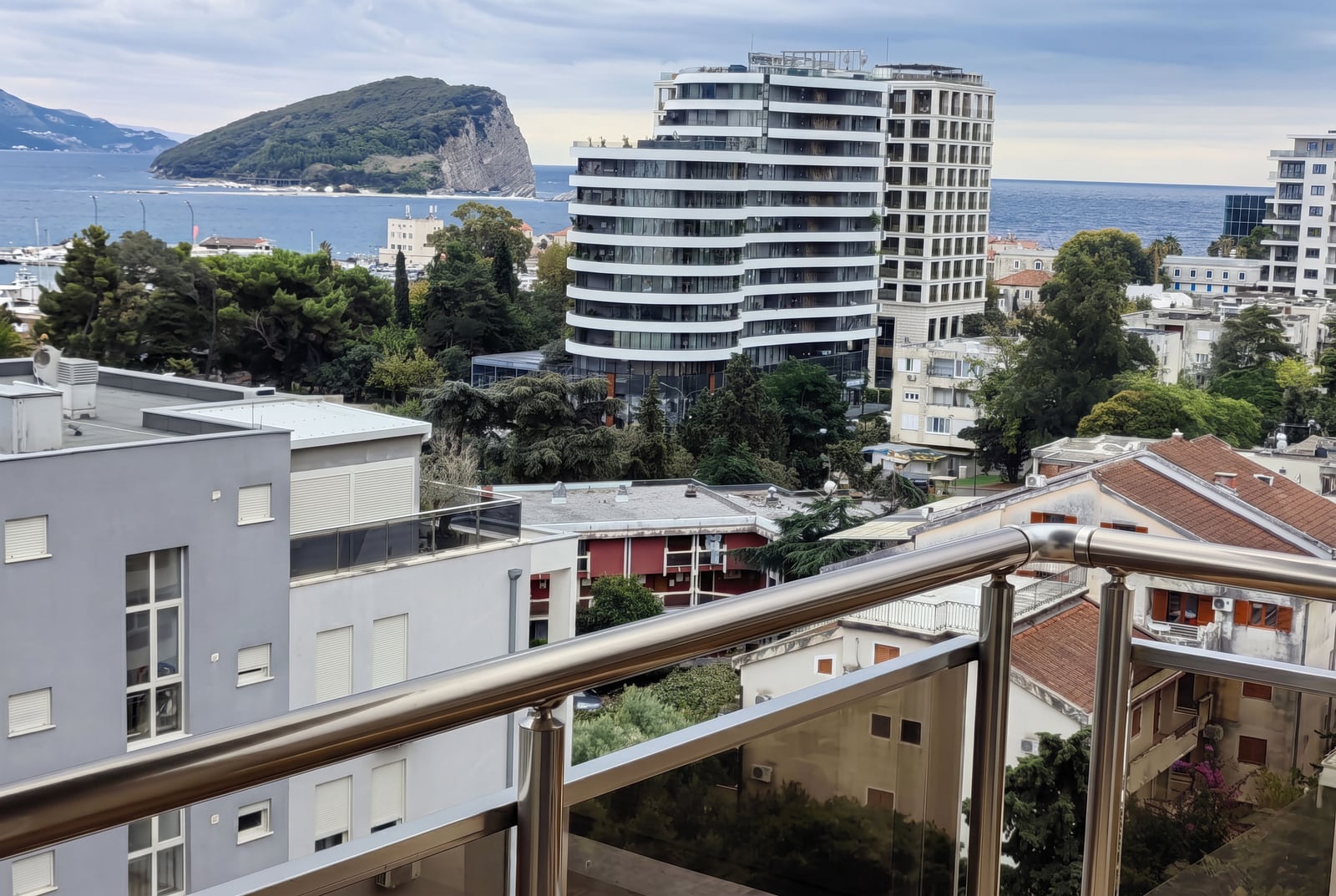 Sea view, city, and Saint Nicholas Island from the balcony of an apartment in Budva, Montenegro.
