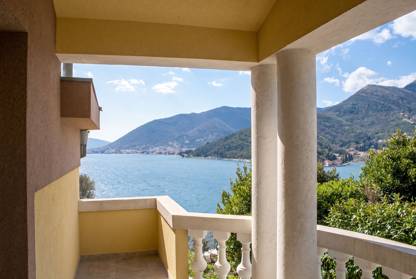 View of the Bay of Kotor and the mountains from the spacious balcony of a house in Tivat, Montenegro.