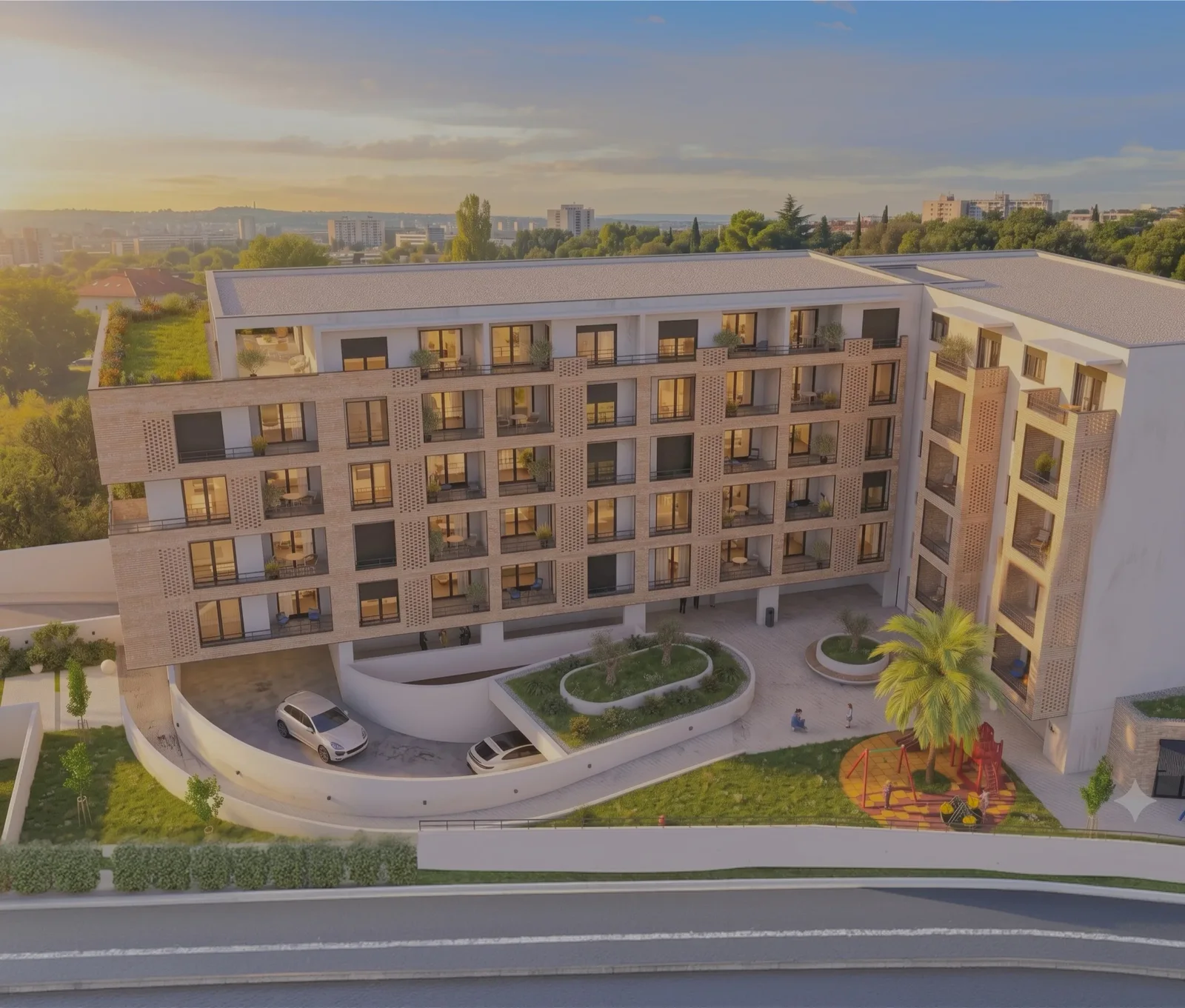Balkonları, iç avlusu, otoparkı ve oyun alanı olan modern bir konut kompleksinin havadan görünümü.