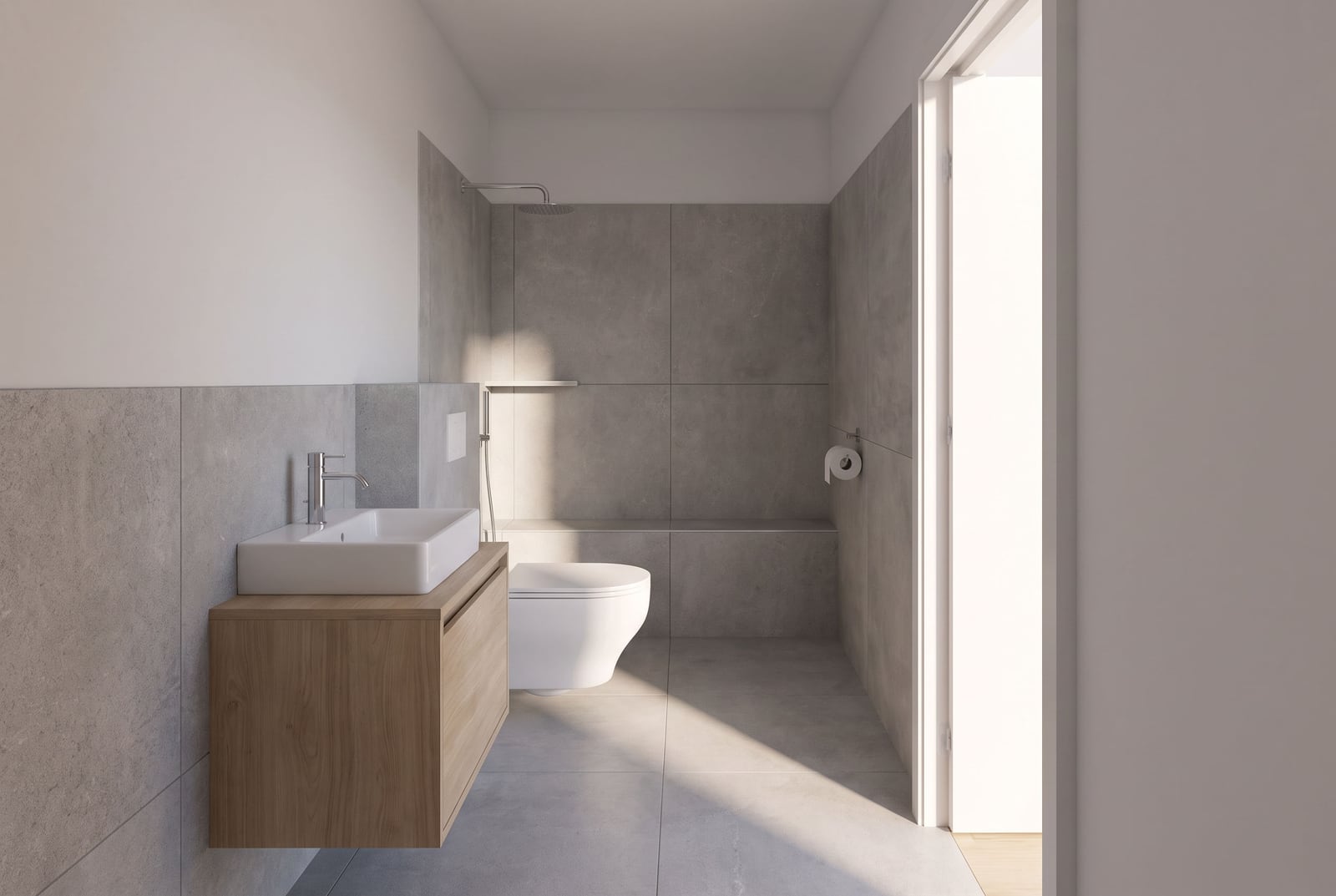 Modern bathroom with gray porcelain tile finish in an apartment in Budva, Montenegro: wall-hung vanity and shower.