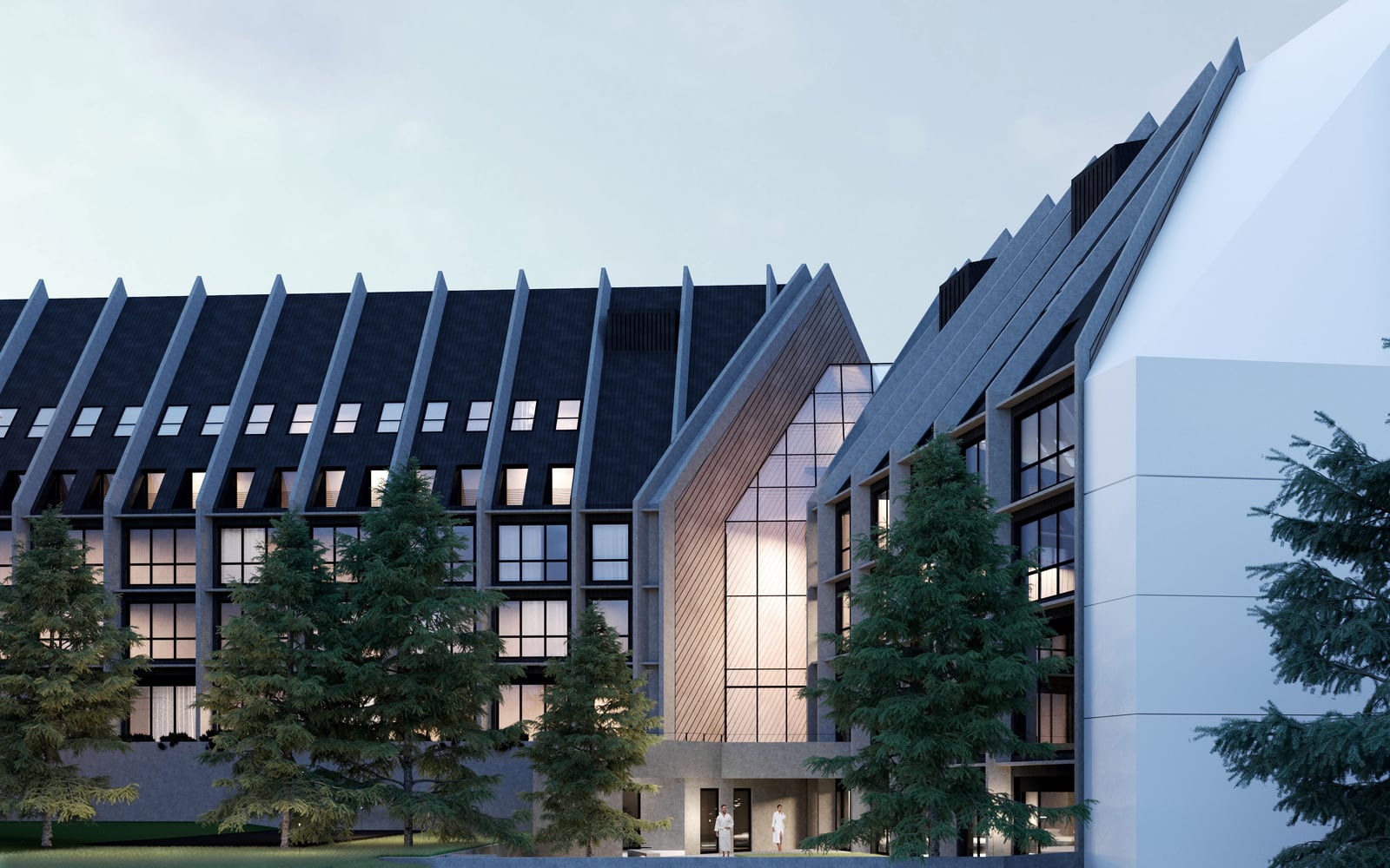 Modern hotel in Kolašin, Montenegro: facade with panoramic glazing and a pitched roof surrounded by spruce trees.