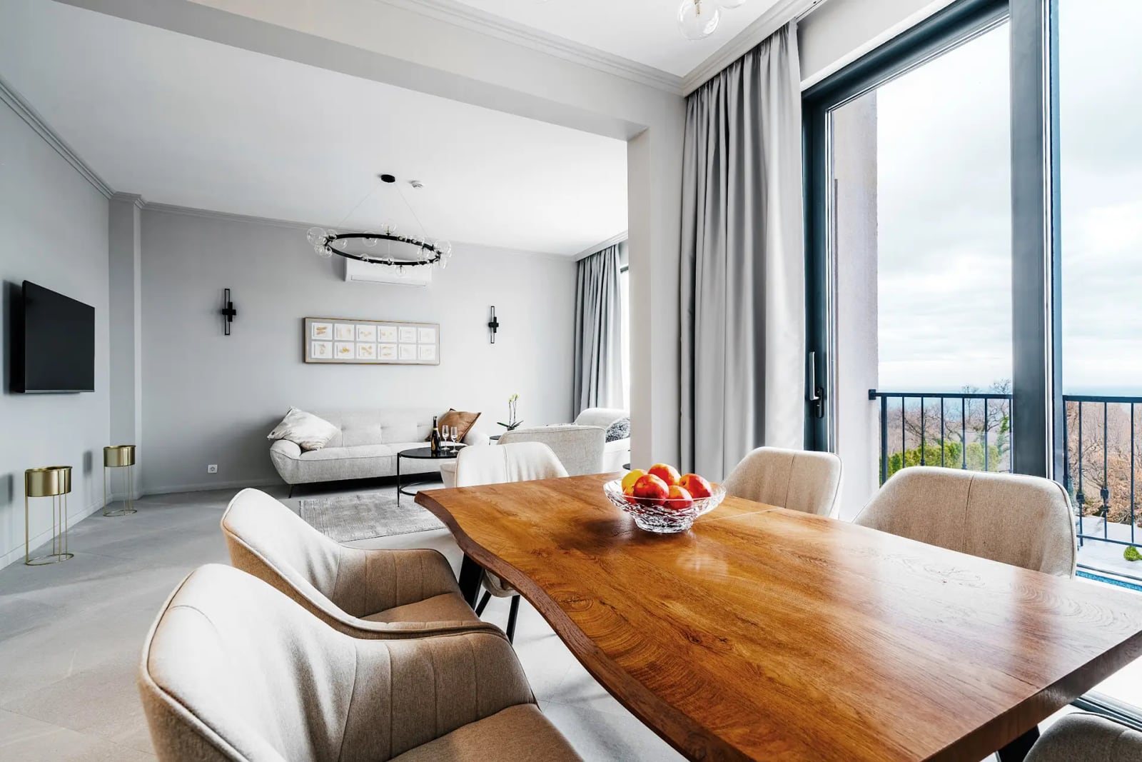 Living room with a dining area and panoramic sea views in a modern villa, Reževići, Montenegro.