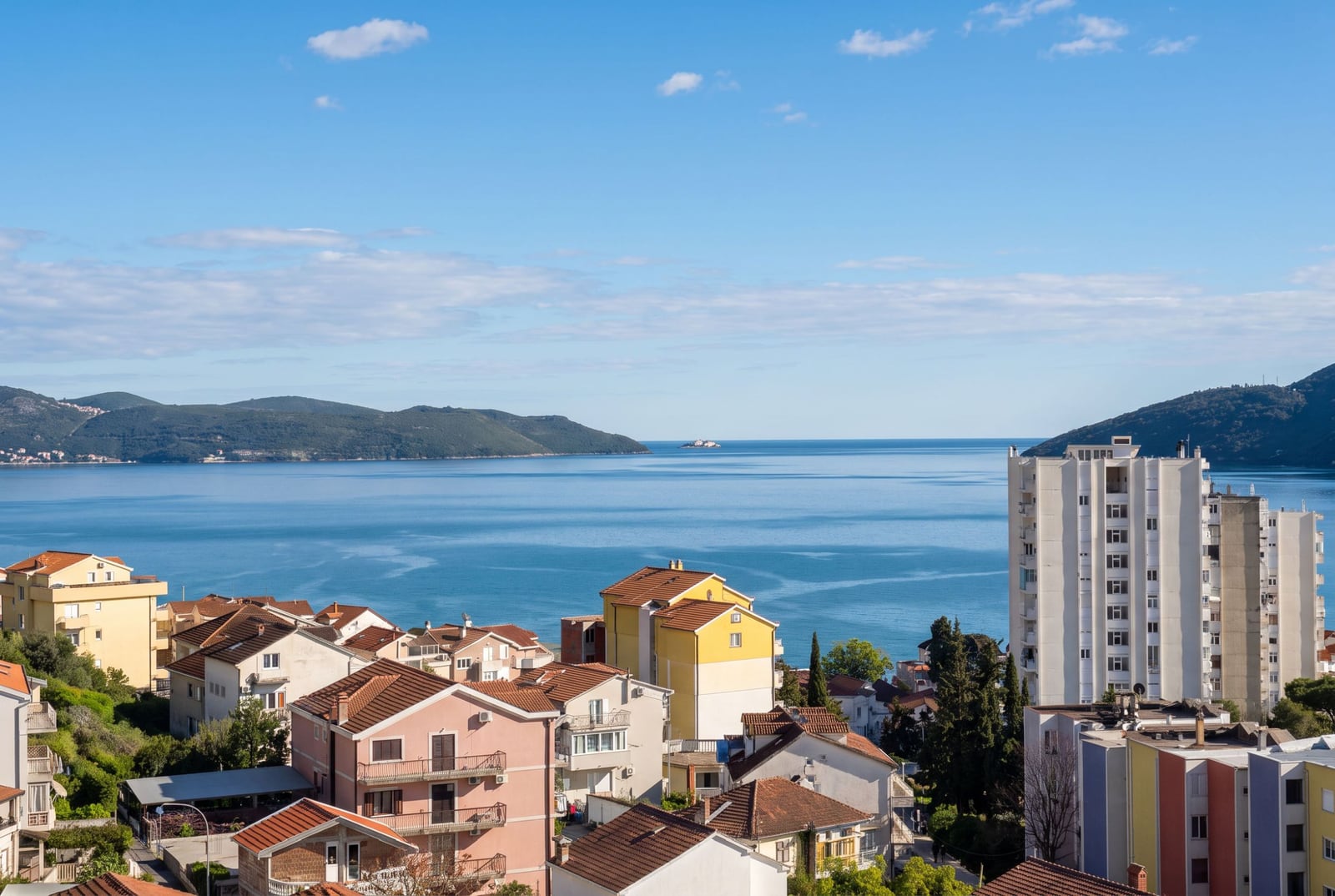 Panoramic view of the sea and mountains from the balcony of an apartment in Igalo, Montenegro