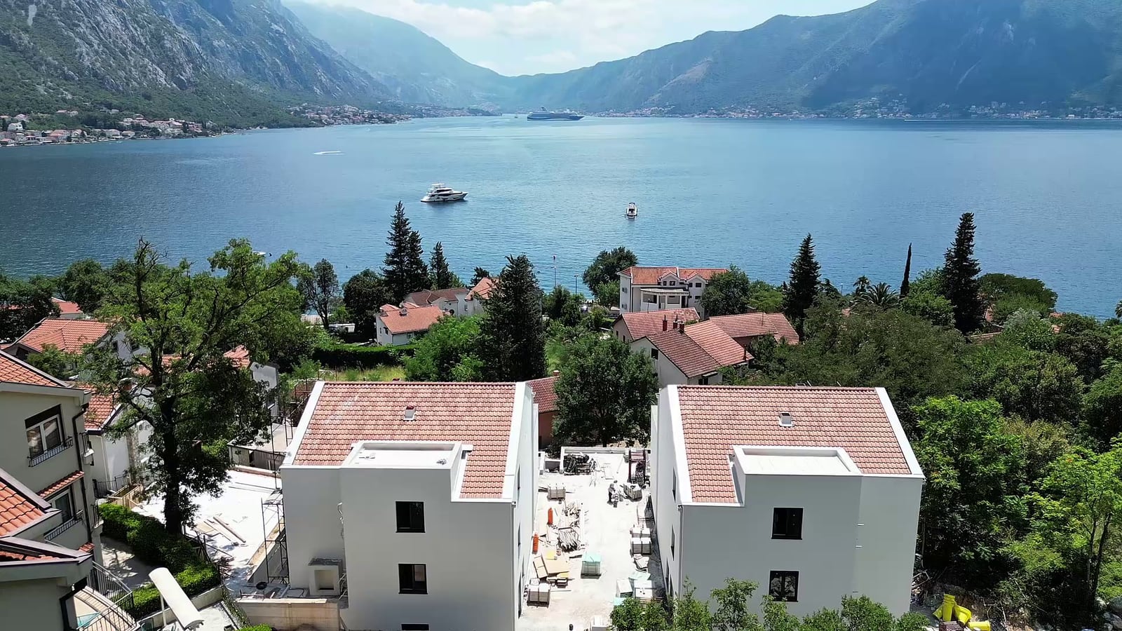 Panoramic view of the Bay of Kotor and mountains from the terrace of a penthouse in Orahovac, Montenegro.
