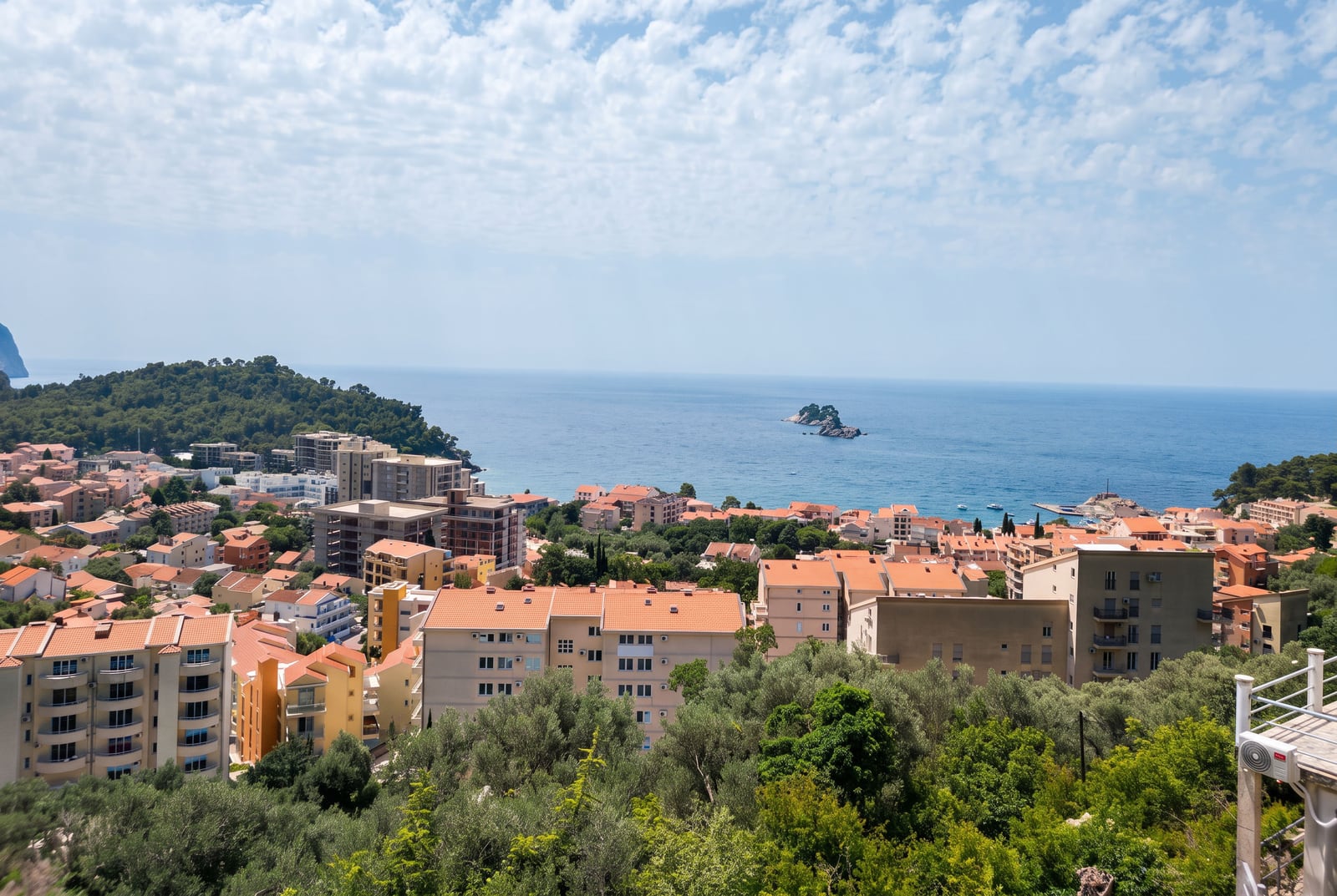 Panoramic view of the Adriatic Sea, the town of Petrovac, and the mountains in Montenegro