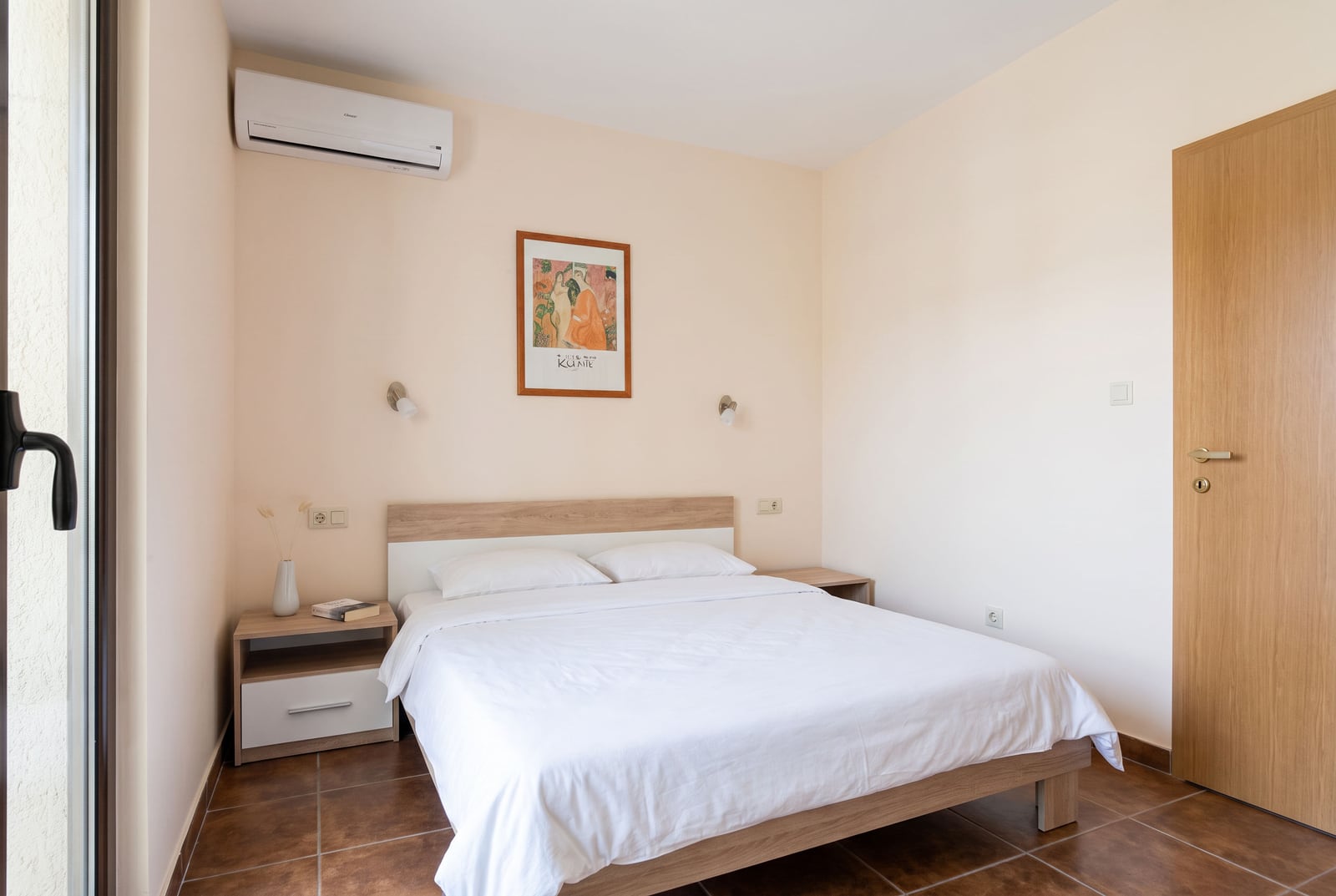 Bright bedroom with a double bed and air conditioning in a house in Tivat, Montenegro