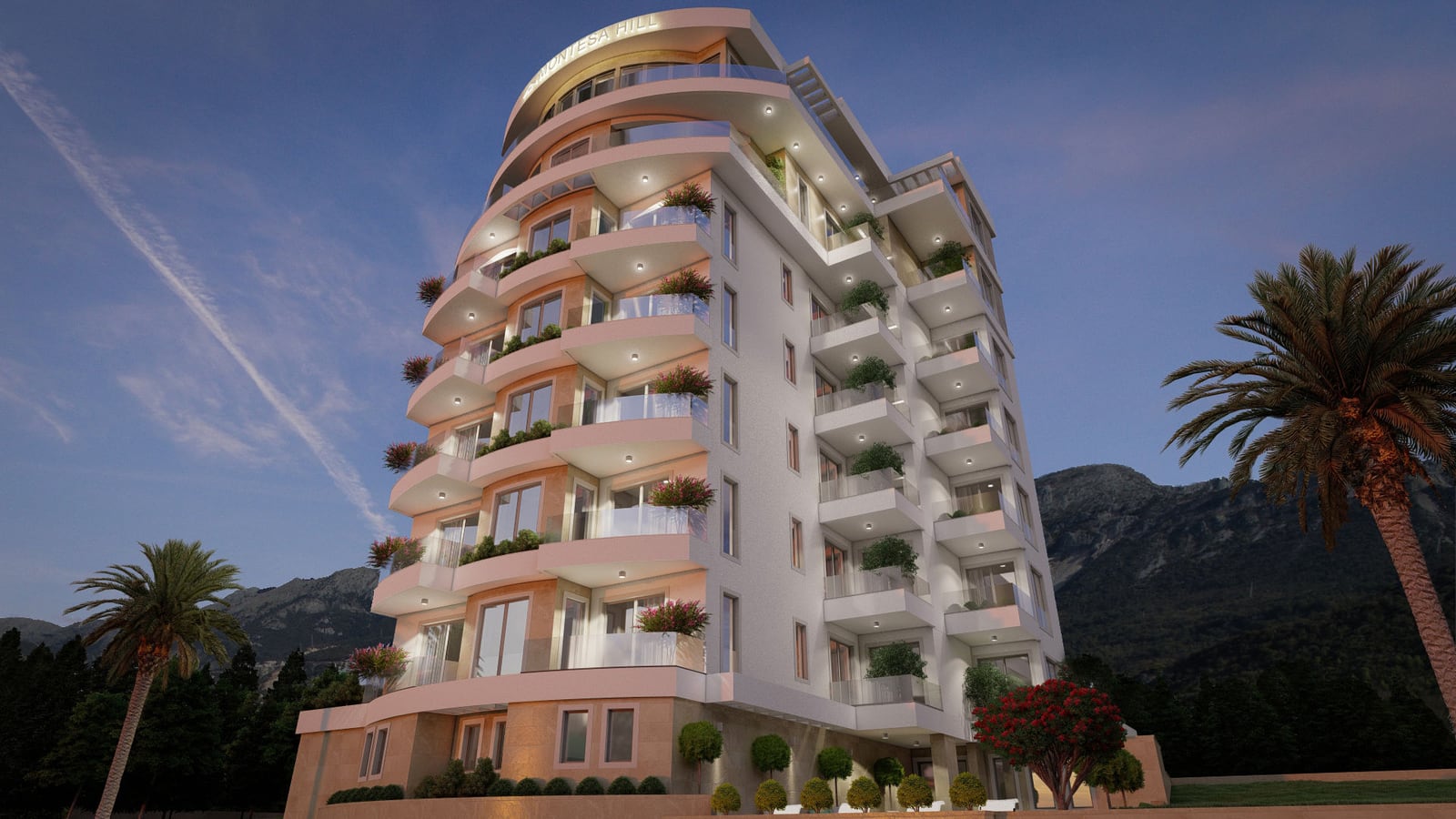 Modern multi-story residential building with terraces, panoramic windows, and lighting in Becici, Montenegro