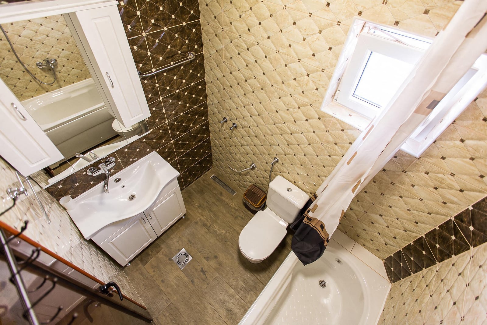 Modern bathroom with a shower cabin, sink, and toilet in an apartment in Budva, Montenegro