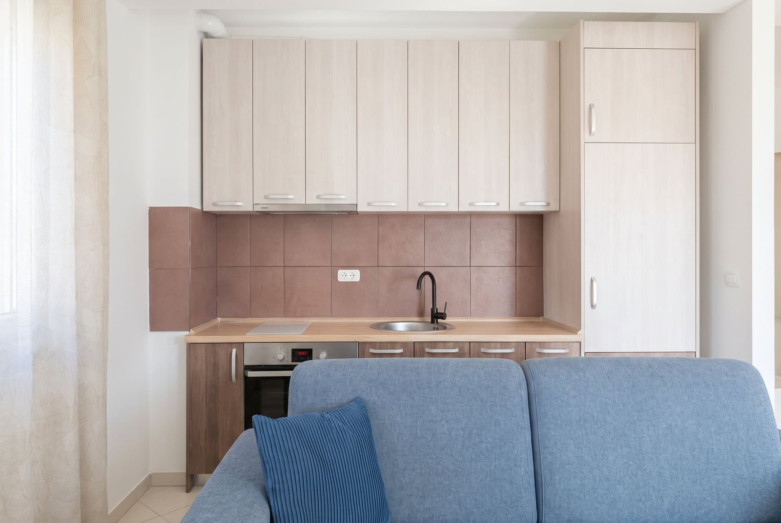 Modern kitchen with furniture and appliances in an apartment in Budva, Montenegro