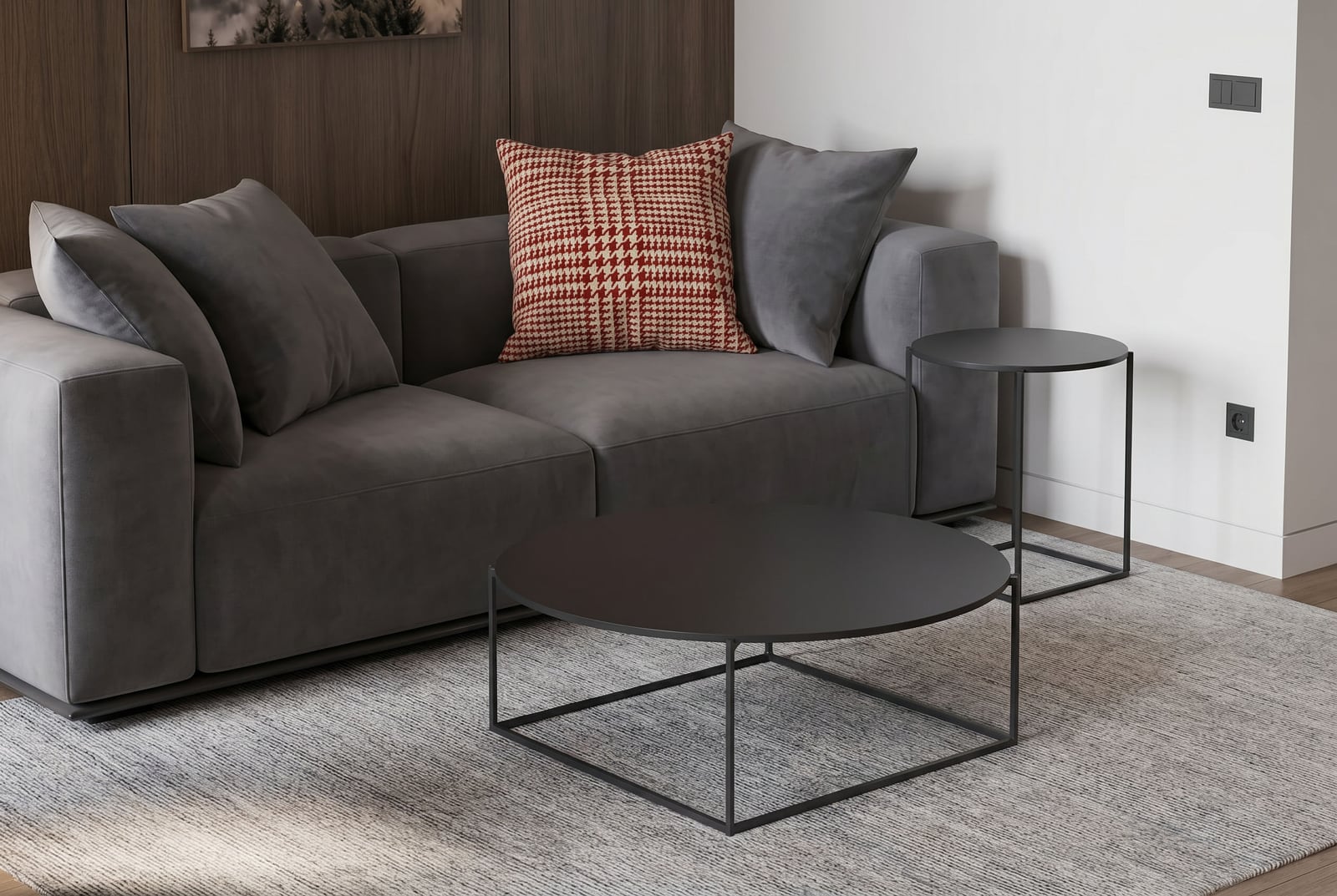 Modern living room with a grey sofa and coffee tables in a hotel apartment, Kolašin, Montenegro.