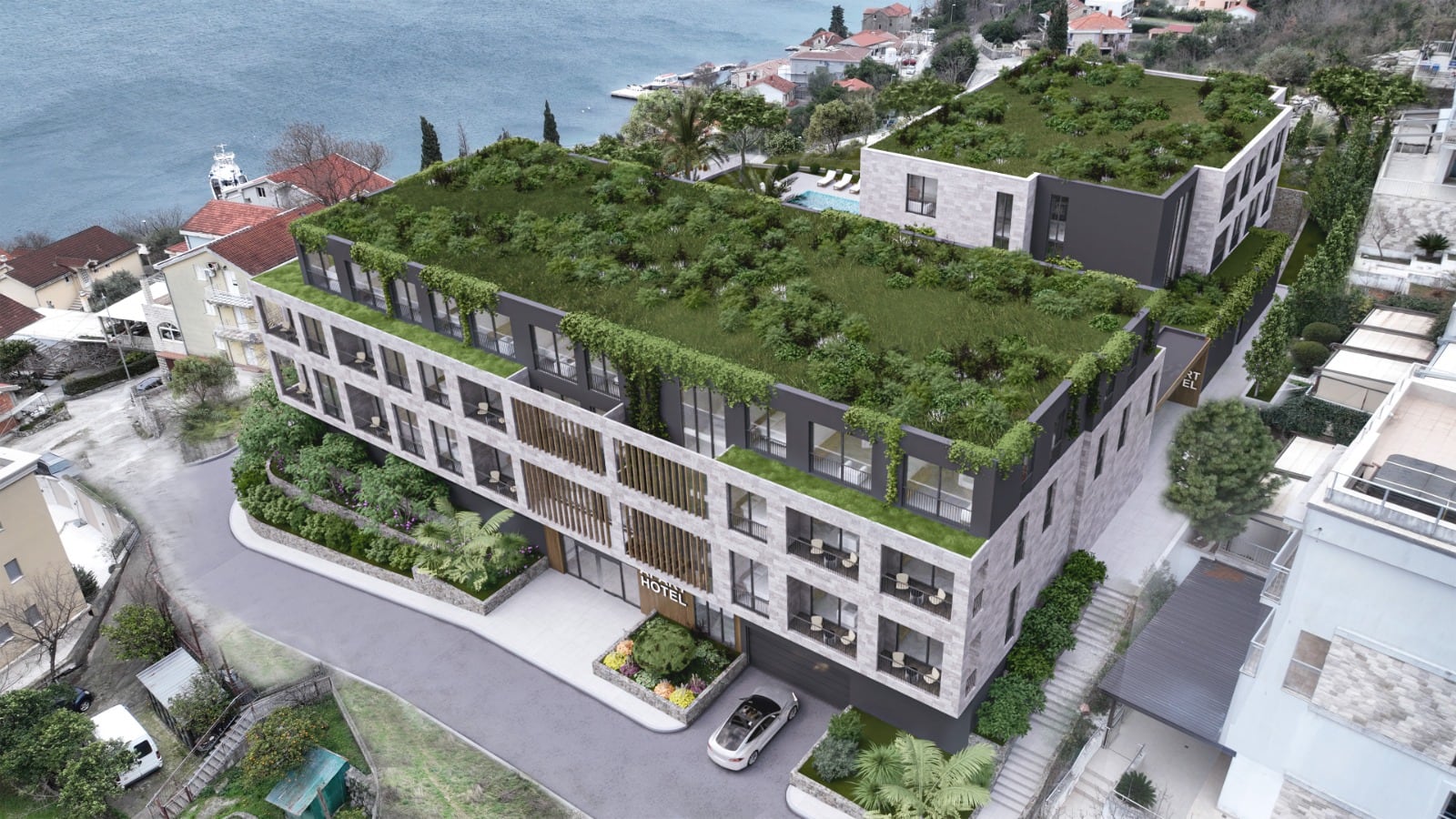 Moderan hotel sa zelenim krovovima i panoramskim pogledom na more u Dobroti, Crna Gora
